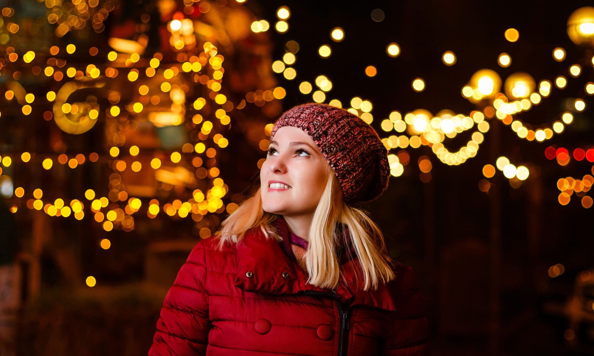 happy girl looking at christmas lights