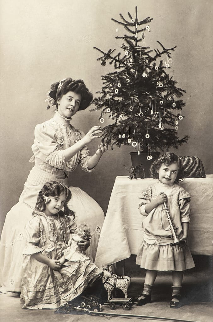 Mom and kids with an old Christmas tree